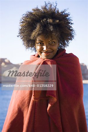 Portrait of a young woman wrapped in a blanket