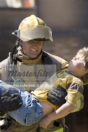 firefighter carrying baby