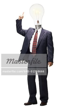 Businessman pointing to light bulb on head