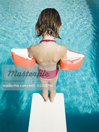 Girl diving into swimming pool