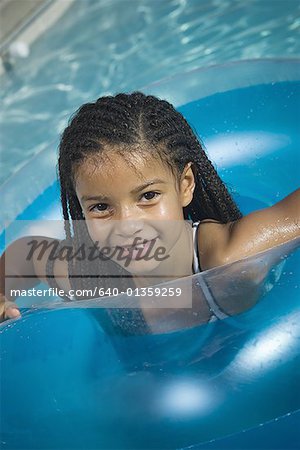 Portrait of a girl inside of an inner tube