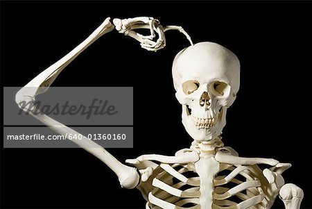 Skeleton scratches head trying to figure out next chess move Stock Photo -  Alamy