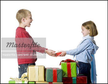 Sister giving gift to her brother at Raksha Bandhan Stock Photo #64246840