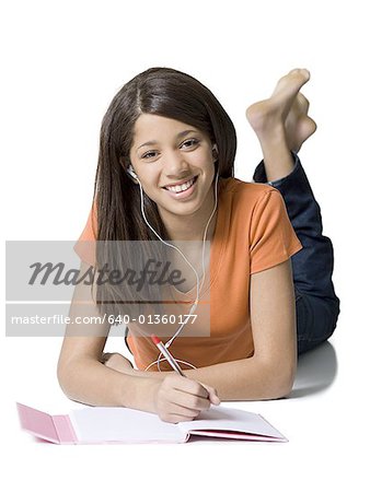 Close-up of a girl writing in a notebook