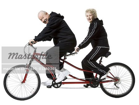 Older couple riding a tandem bicycle - Stock Photo - Masterfile - Premium  Royalty-Free, Code: 640-01360365