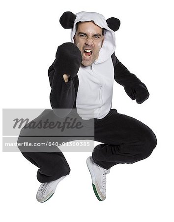 Portrait of a mid adult man dressed in a bear costume