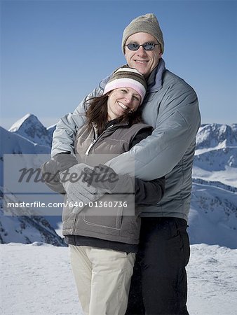 Portrait of a mature man embracing a mature woman from behind