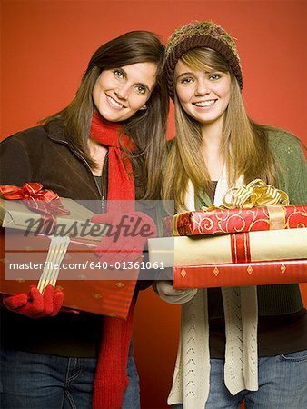 Mother and daughter with Christmas gifts