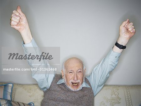 Portrait of a senior man raising his arms in excitement - Stock Photo -  Masterfile - Premium Royalty-Free, Code: 640-01361468