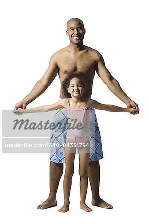 Father holding young daughter