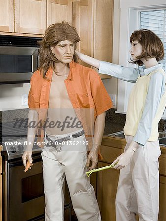 Close-up of a male mannequin and a female mannequin in the kitchen