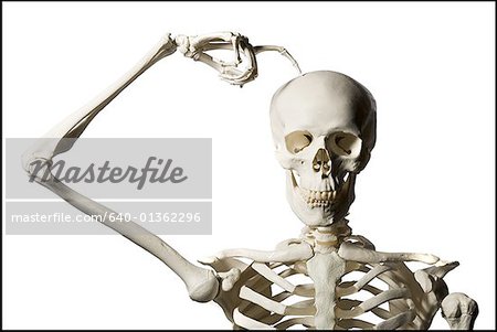 Skeleton scratches head trying to figure out next chess move Stock Photo -  Alamy