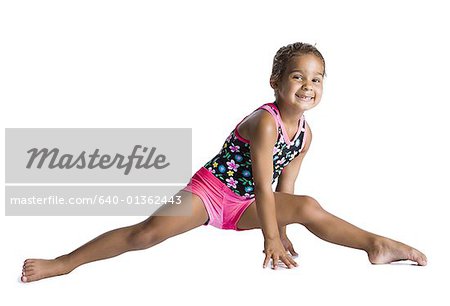 Little girl gymnast stretch floor hi-res stock photography and