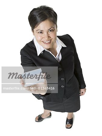 High angle view of a businesswoman holding a nametag