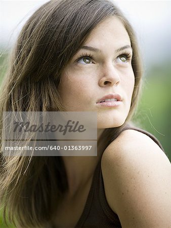 Close-up of a teenage girl looking up