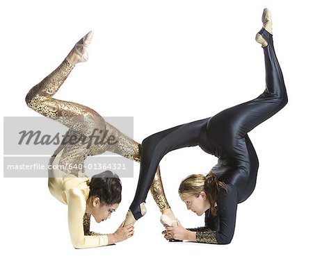 Female contortionist duo performing