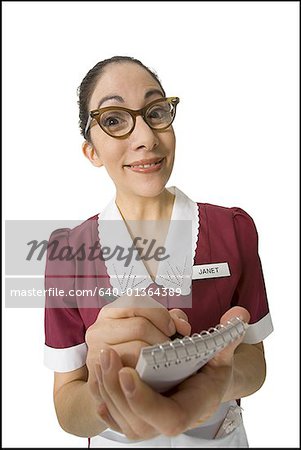 Portrait of a waitress writing on a note pad
