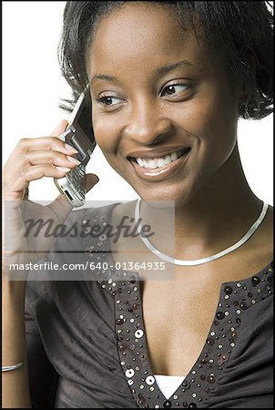 Close-up of a young woman talking on a mobile phone