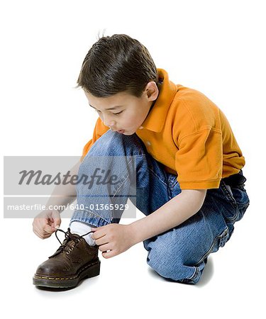 boy tying shoes