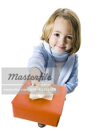 Portrait of a girl holding a gift