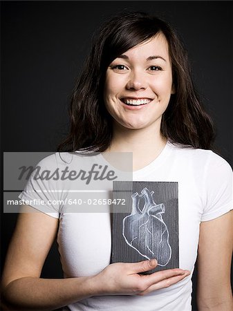 Woman with a drawing of a heart