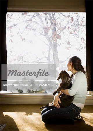 woman and dog in living room