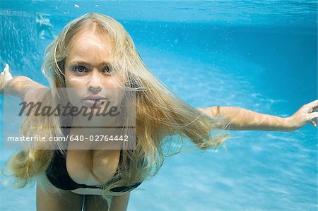 Portrait of a teenage girl swimming underwater, Stock Photo, Picture And  Royalty Free Image. Pic. WR0906977