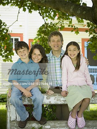 Portrait of a mature man and a mid adult woman with their son and daughter