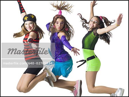 Three girls leaping with costumes