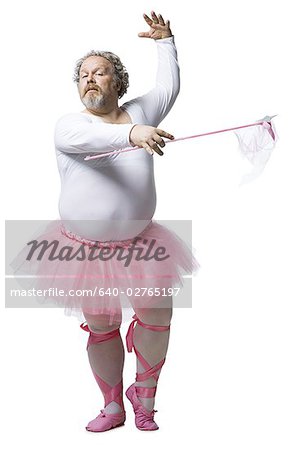 Overweight man in ballerina tutu smiling