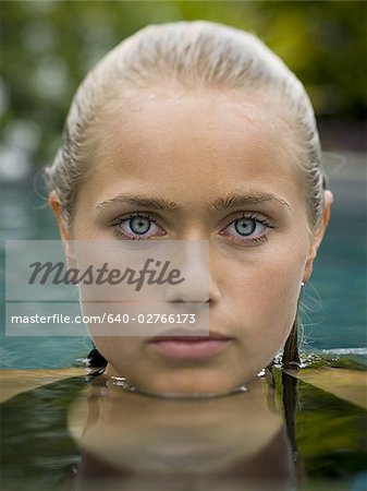 Portrait of a teenage girl in a swimming pool