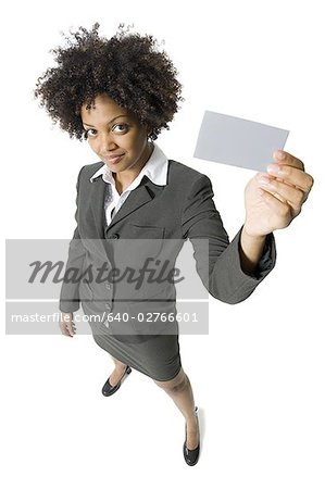 High angle view of a businesswoman showing a blank sign