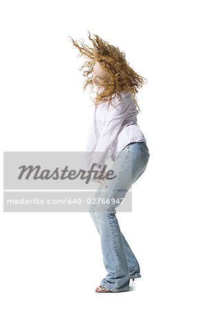 Profile of a young woman dancing