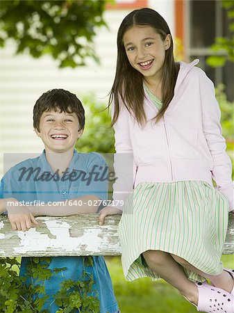 Portrait of a girl and a boy smiling