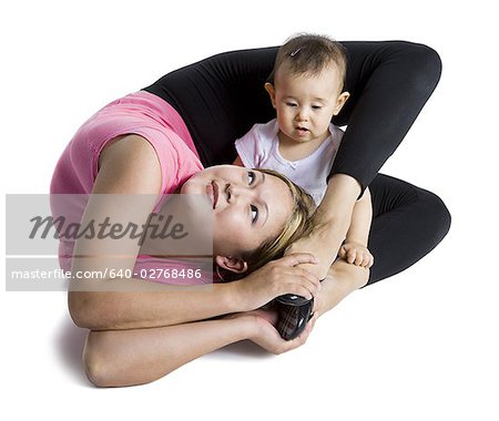 Contortionist mother with baby daughter