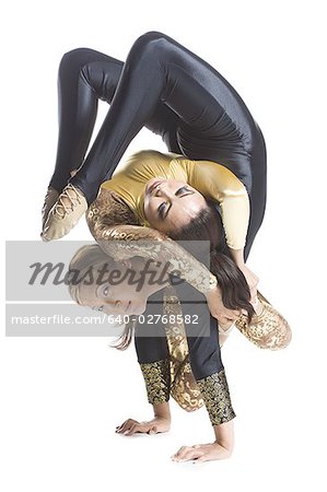 Female contortionist duo performing