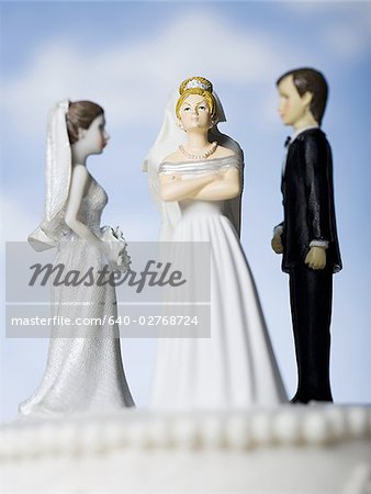 Wedding cake visual metaphor with figurine cake toppers