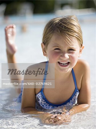 Young girl in wading pool