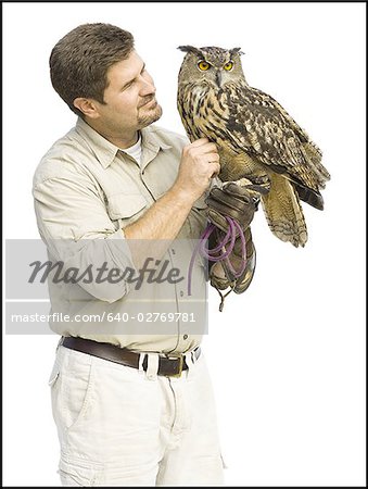 Animal handler with owl