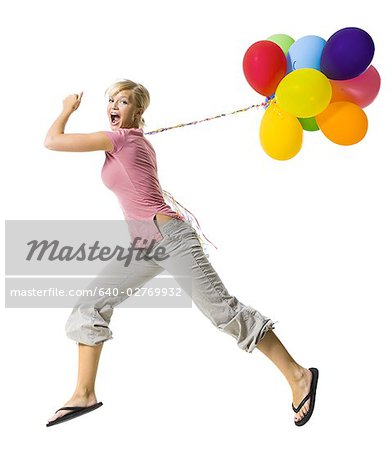Woman with helium balloons