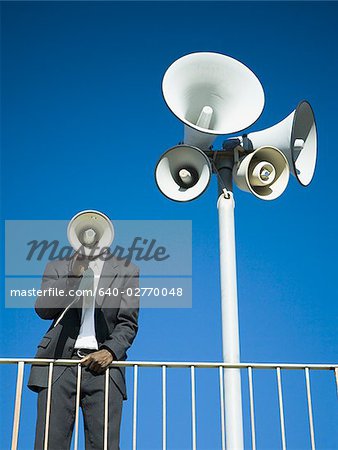 Man yelling through bullhorn