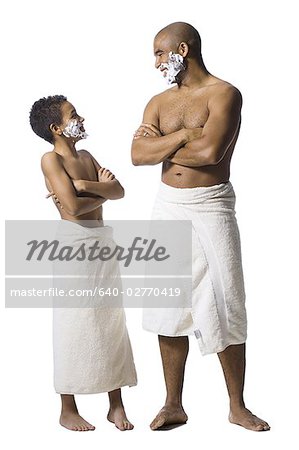 Father and son shaving together