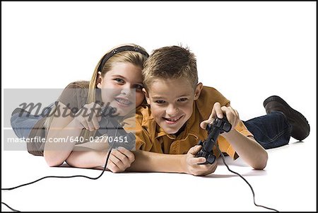 Children playing video game - Stock Photo - Masterfile - Premium