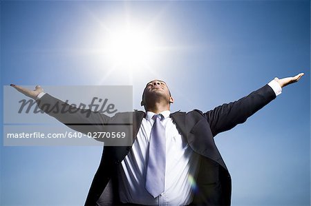 Businessman with outstretched arms