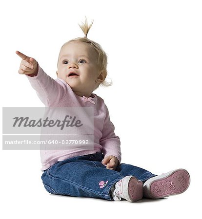 Baby Girl with ponytail pointing up