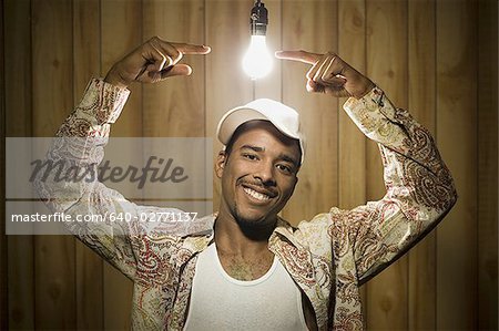 Man pointing at light bulb