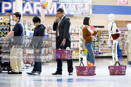 Four people and a skeleton in grocery store lineup