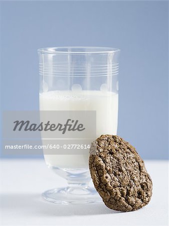 Glass of milk with chocolate cookie