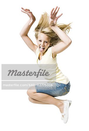 Girl smiling and leaping with hand up