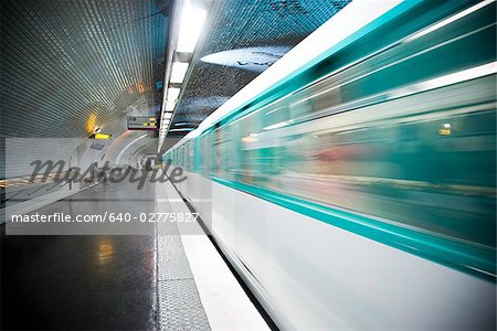 Subway platform with subway in motion